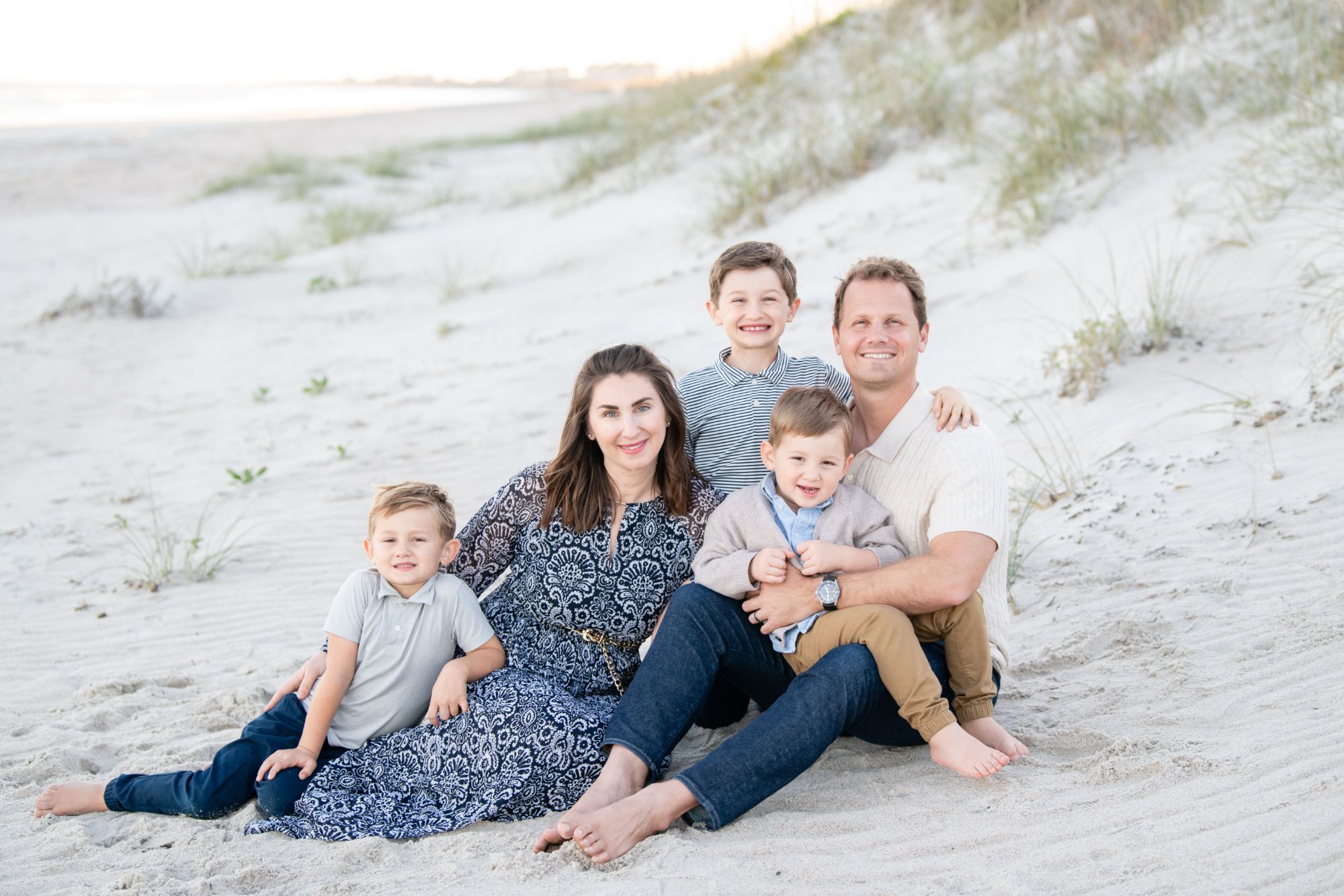 Clayton Dean with his wife and three sons on the beach